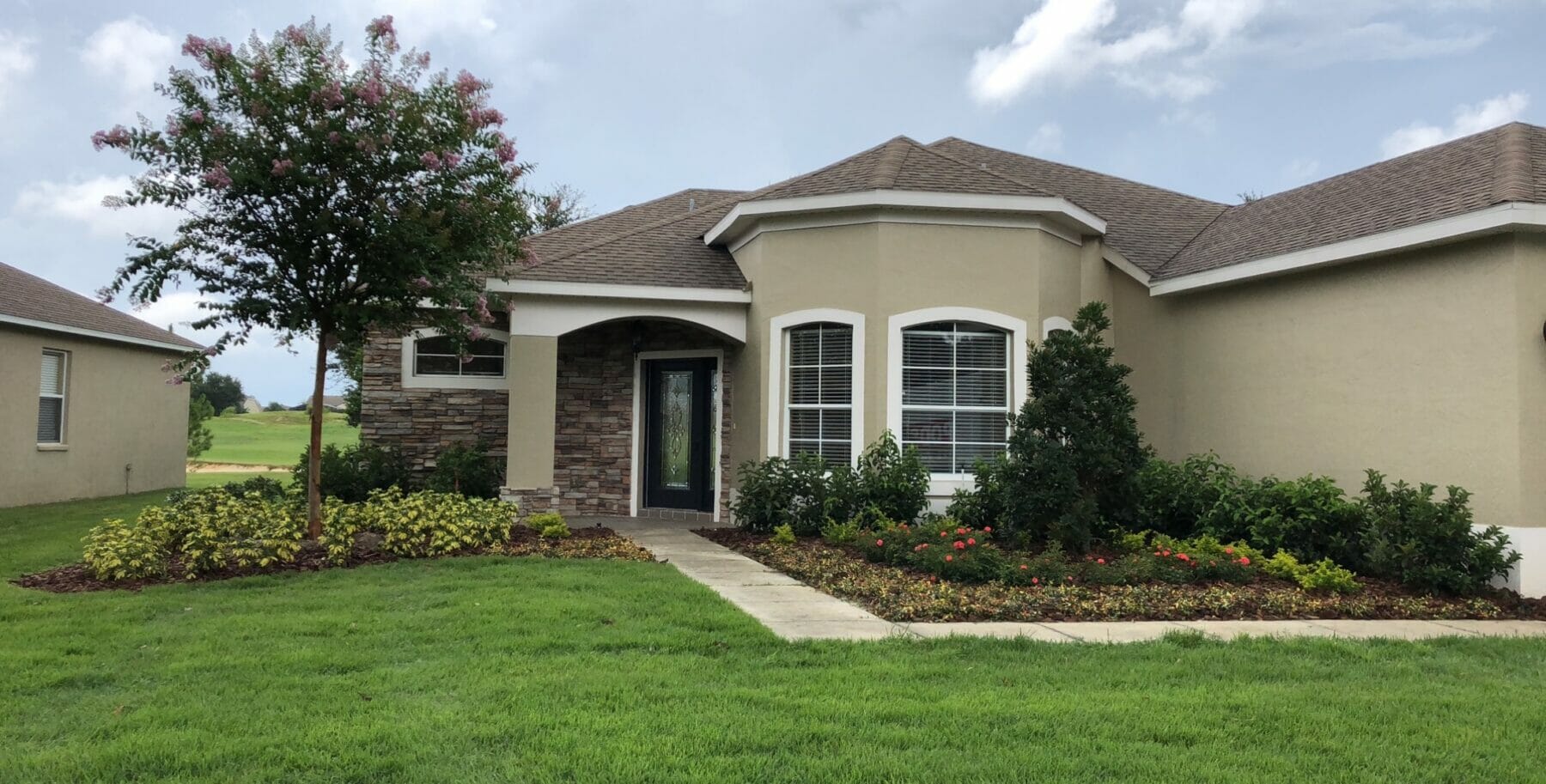 Landscaping in front of beautiful home